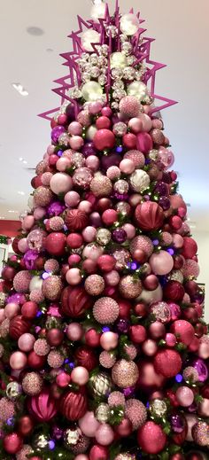 a christmas tree with pink and purple ornaments