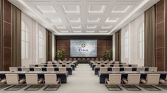 an empty conference room with tables and chairs in front of a large projector screen