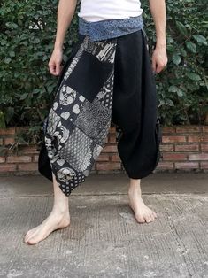 Item details Materials cotton,  hmong fabric, thai, japanese print FEATURE: Handmade Ethically, Breathable, Unisex, Comfortable to Wear & Stylish. indigo MATERIAL: 100% Cotton, Handmade  Sizing : Tie Waist or Wrap pants Waist up to : 21 inch 44 inch ( 53.36 -111.75 cm ) Hip up to : 64 inch ( 142 cm ) Length     : 34 inch ( 78 Cm ) 1 Pocket COLOR: Black Special Promotion  -Shipping by priority mail to USA Next all item get Free priority mail to USA  Non USA shipping by Air Mail registered. GENDER: M/F This beautiful samurai pants is unique & comfortable to wear. Handmade with very lovely pattern, it is easy to wear and great for many occasions. Unique handmade embroidered waist patches are made with Cotton fabric, each pair are a slight different which makes them an one-of-a-kind. One size Camping Pants, Hmong Fabric, Japan Pattern, Samurai Pants, Thai Fisherman Pants, Fisherman Pants, Tie Waist Pants, Japanese Print, Wrap Pants