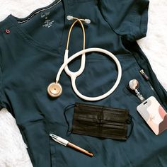 a doctor's uniform, stethoscope, wallet and other medical supplies