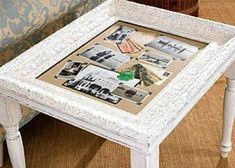 a small white table with pictures on it