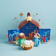 a nativity scene with two figurines and a star