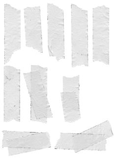 several pieces of torn white paper on a white background