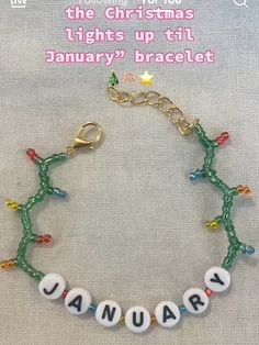 a beaded bracelet with the words january written in white letters and beads on it