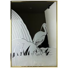 an image of a bird with wings on it's back in a mirror frame