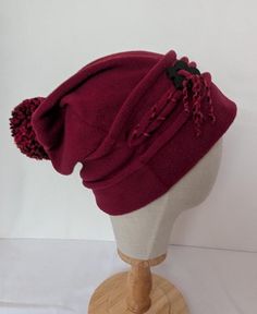 Stay cosy and stylish this winter with my dark red slouchy hat, designed for ultimate comfort and flair. The decorative braiding adds a unique touch, while the charming daisy button detailing brings a playful element to your cold-weather wardrobe. Perfect for any casual outing, this hat is a must-have accessory to keep you warm and fashionable all season long. size medium - Large Slouchy Winter Hat, Hat With Braids, Slouchy Hat, Winter Hat, Dark Red, Cold Weather, Halloween Shopping, Caps Hats, Accessories Hats