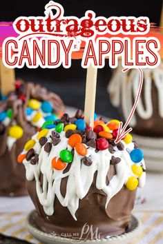 chocolate covered candy apples with white frosting and colorful candies on top that says outriggers candy apples