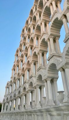 an intricately designed building with columns and arches