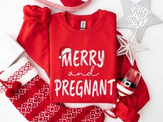 Tis the season for a baby bump! 🎅 Wear your holiday spirit (and belly) proudly with this merry and pregnant sweater!  UNISEX SIZING- Most customers feel the shirts fit TRUE TO SIZE, however, ladies should size down if they prefer a fitted look or if they have a petite body frame. PRODUCTION TIME: 1-3 days (Usually 2 days) SHIPPING TIME: 2-5 days (Usually 3 days) Product Features - Medium-heavy fabric  - Double-needle stitching for durability - Ribbed knit collar for shape retention - Ethically Pregnant Shirt, New Mom Shirt, Funny Pregnancy, Christmas Pregnancy Announcement, Christmas Pregnancy, Baby Announcements, Maternity Tees, Christmas Pjs, Pregnancy Humor