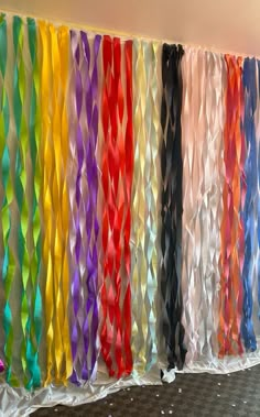 colorful streamers are hanging on the wall