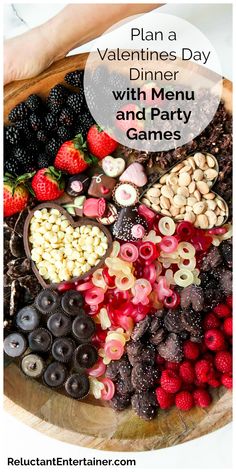 valentine's day dinner with menu and party games on the table, including berries