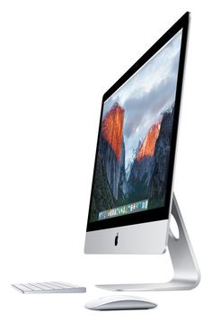 an apple desktop computer sitting on top of a white desk next to a keyboard and mouse