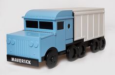 the toy truck is painted blue and white