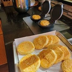 there are some biscuits on the counter ready to be cooked in the stove top oven