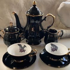 black and white porcelain tea set with gold accents