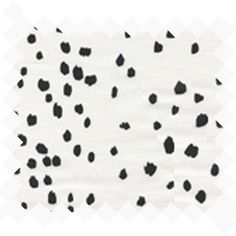 black and white spotted fabric with small dots on the bottom half of it, as if in an animal print pattern