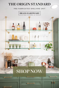 a kitchen with green cabinets and shelves filled with bottles, glasses, and other items