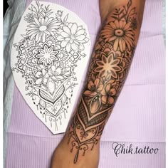 a person with a tattoo on their arm next to a flower and heart coloring book