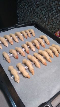 there are many toy animals that are on the baking sheet in the oven and ready to go into the oven