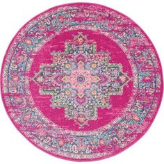 a pink rug with an ornate design on the center and bottom, in various colors