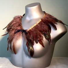 "This is a luxurious custom piece created using brown and black rooster feathers and satin ribbon. This simple shawl design wraps elegantly around your neck and shoulders and ties in the front. You can even opt to wear this around your waste if desired. There are many options. Size is approximately 2' long by about an average of 7\" wide not including the ribbon tie. Perfect for Fairy Festivals, Fanciful Halloween Costumes, Masquerade Balls, Cosplay Events, Stage Performances, Dance Accessory, E Feather Shawl, Shoulder Shrug, Egypt Project, Nature Outfits, Shawl Design, Black Rooster, Fairy Festival, Avatar Fan Art, Rooster Feathers