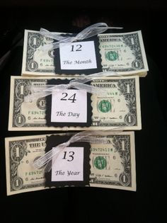 three twenty dollar bills tied with white string