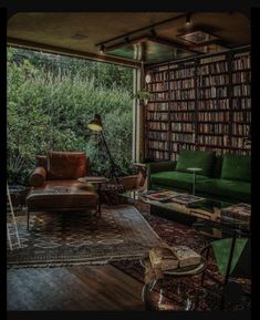 a living room filled with furniture and lots of books