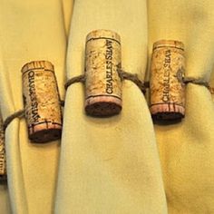 three wine corks wrapped in white fabric