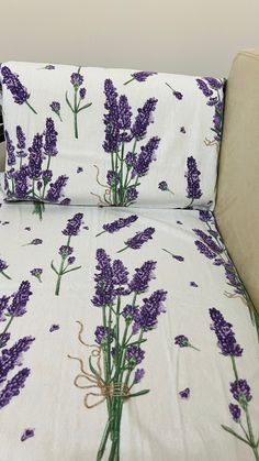 the bed has lavender flowers on it