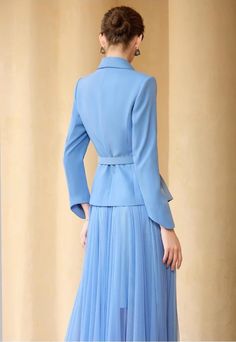 Say hello to that look of yesteryear with this Sky Blue Pleated Skirt Suit! Graceful and timeless, it features a full skirt, perfect for twirling and showing off your best dancing moves. Plus, you won't have to wait long to add it to your wardrobe - buy now and start showing off that sophisticated '50s style! Peak lapels; double-breasted V-neck, Long sleeves; button cuffs. Structured shoulders. Full pleated skirt with high waist Belted POLYESTER 100% Imported Brand - Aision Model: 233004 Dancing Moves, Wedding Guest Outfit Winter, Blue Pleated Skirt, 50s Style, 50s Fashion, Skirt Suit, Full Skirt, Wedding Guest Outfit, Waist Belt