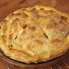 a pie sitting on top of a metal rack