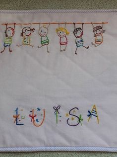 a white towel with children's name written on it