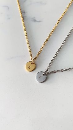 Two (2) personalized initial charm necklaces made for everyday wear. Each item is specially hand stamped and personalized to offer a variety of meaning and love to your pieces. All materials are made of stainless steel and can be customized with a single horoscope symbol or a maximum of two characters (e.g. letters and numbers). Each charm is 8mm in diameter. Please message us if you have specific requests for your order. *Please note that each necklace comes with one stamped (1) charm. If you would like more than one (1) charm on each necklace, please send an inquiry to us on Etsy  How to Order: Step 1 - In the first drop down menu, select the colour and length of the first necklace Step 2- In the second drop down menu, select your colour of choice and length for the second necklace Step His Initials Necklace, Matching Gifts For Couples Ideas, Matching Necklace For Couples, Couples Necklace Matching, Initial Necklace For Boyfriend, Matching Items For Couples, Matching Things With Boyfriend, Boyfriend Necklace For Him, Couple Necklaces Matching