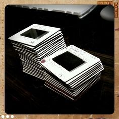 a stack of black and white electronic devices sitting on top of each other