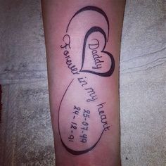 a tattoo on the leg of a person with a name and two hearts in it