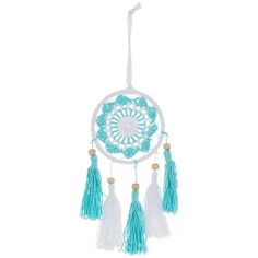 a blue and white dream catcher hanging on a wall