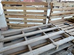 several wooden pallets stacked on top of each other