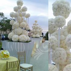 there are many white flowers on display at this wedding reception, and the table is set up with yellow linens