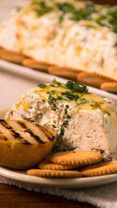 a white plate topped with cheese and crackers