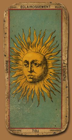 an old book with a drawing of a sun on it