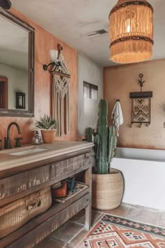 a bathroom with a tub, sink and cactus in the corner on the rug next to the bathtub