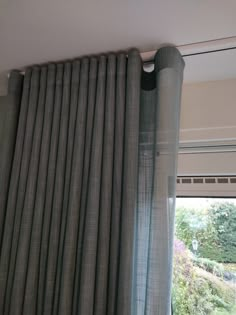 the curtains are closed in front of an open window