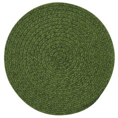 a round rug made out of green grass