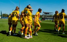 the women's soccer team is congratulating each other