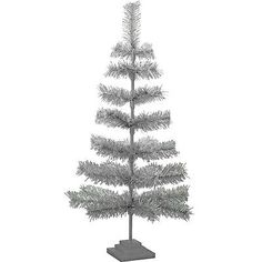 a small white christmas tree on a stand