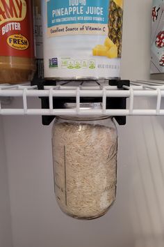 an open refrigerator door with some food in the bottom shelf and other items on the shelves