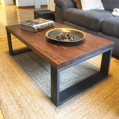 a coffee table with a plate on it in a living room