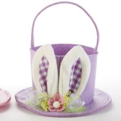 an easter basket with two bunny ears on it