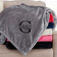 several blankets stacked on top of each other with the word gordan printed on them