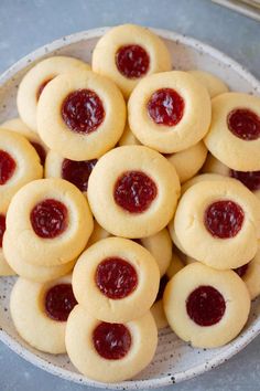 a bowl filled with cookies covered in jelly